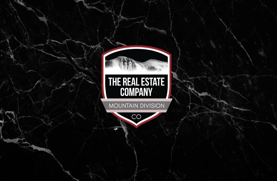 The Real Estate Company — Mountain Division crest logo